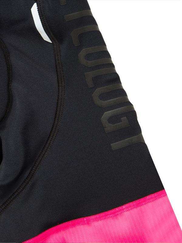 Black and pink women's cycling shorts with 'Cycology' branding on side panel