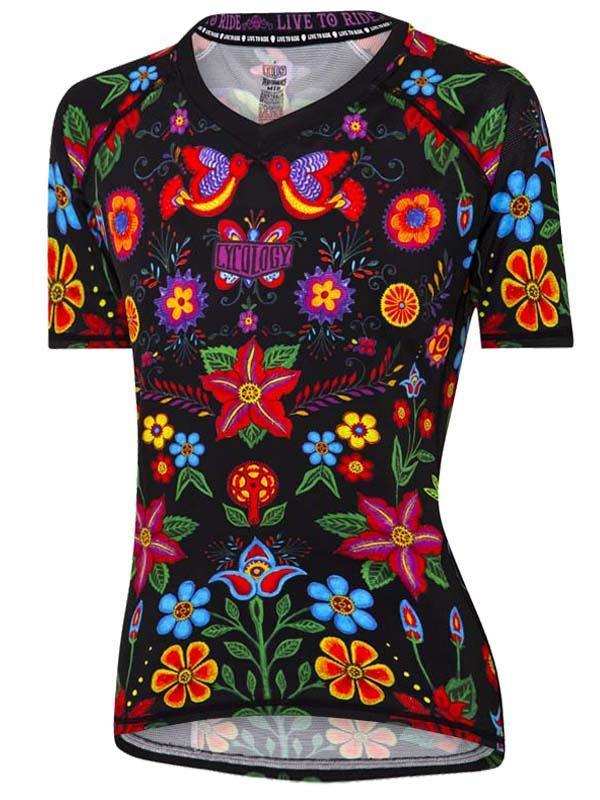 Women's cycling jersey with vibrant floral and bird print on black, featuring short sleeves and performance fit.