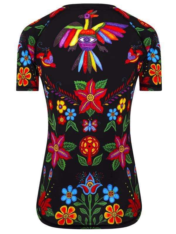 Women's cycling jersey with vibrant floral and bird print on black background, colorful design for bike rides.