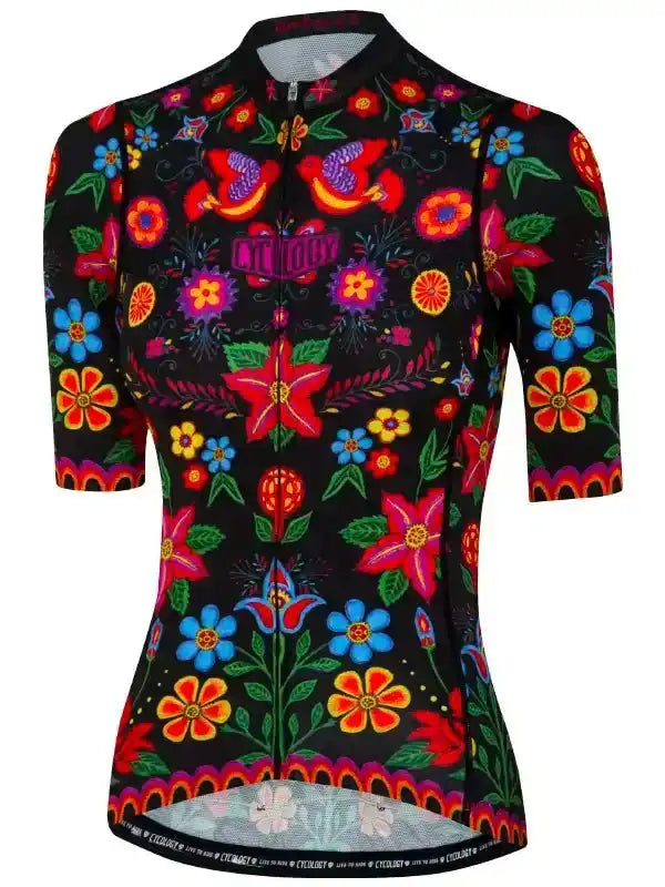 Women's cycling jersey with vibrant floral and bird print on black background, short sleeves, full zip
