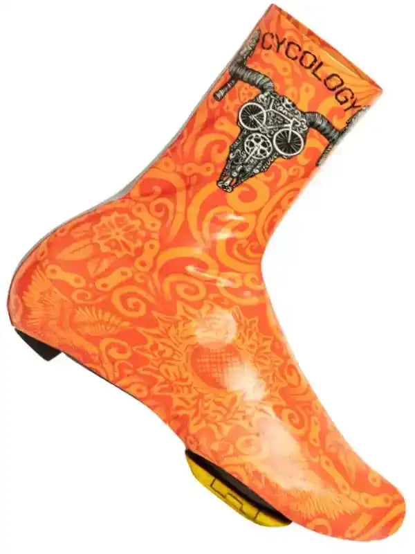 Orange cycling shoe cover with skull and bike graphic, waterproof design for road cycling