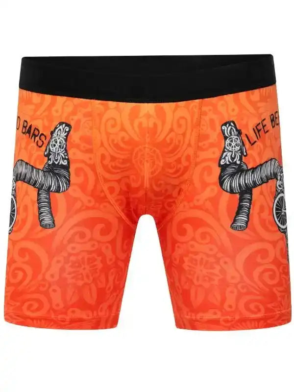 Orange cycling shorts with bike handlebar print and black waistband, men's bike wear