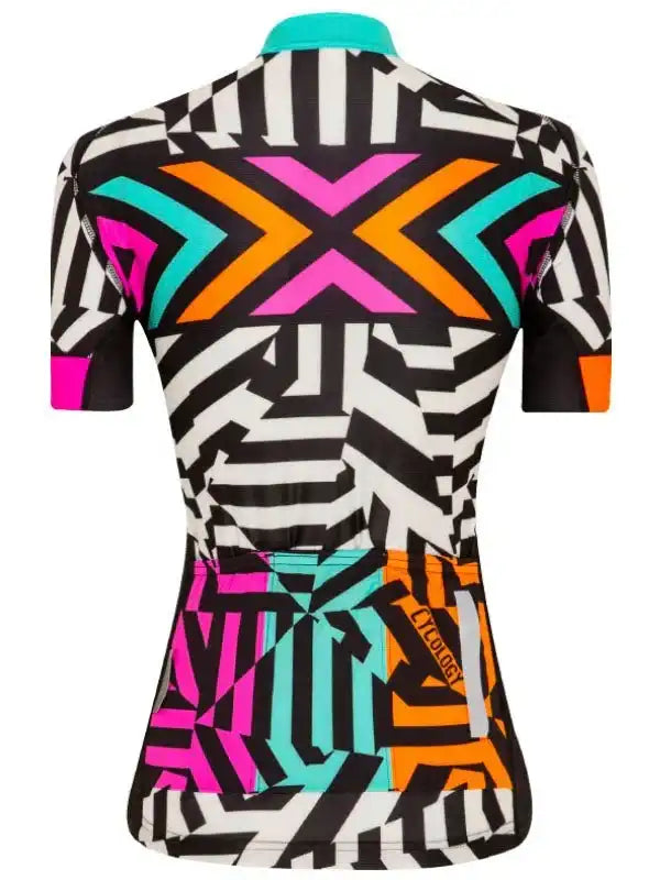 Women's cycling jersey with bold geometric print in neon pink, orange, and teal on black and white background.